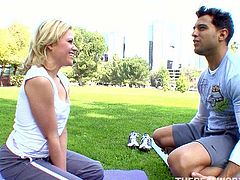 Appetizing blonde chick in flexes her body and starts doing her yoga exercises. One guy touches and strokes her big butt from time to time.