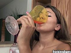 This nasty brunette girl is about to get very kinky in the kitchen. She makes a nice delicious strawberry smoothie and then uses a funnel to pour it into her sweet pussy. She squirts the tasty smoothie into a wine glass and then has herself a taste of the fruit and pussy juice mixture. What a kinky girl she is.