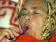Chunky grandma lies in bed all alone fucking her hairy snapper with dildo. She gives blowjob sucking old dick and gets her old fetid snatch licked.