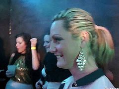 Naughty party lesbians touching their hot bodies with lust in a club