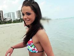 Gorgeous brunette babe in bikini sucks a dick with pleasure. Then she lies down on a bed and takes a dick in her wet pussy in POV video.