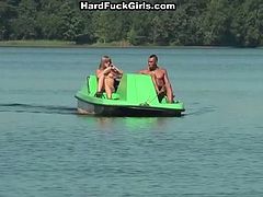 Attractive chick gets on a boat with three horny studs. It is obvious that they seduced her for sex. So she gives them deepthroat blowjob in the open air,