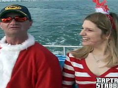 Come on out for a hardcore Christmas Boat trip! She takes Captain Stabbin's whole cock right down her throat then right up her beautiful ass!