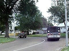 1992 gillig bus going through city in evansville,indiana