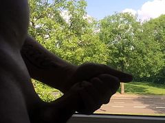 Flashing naked in window.