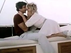 Sassy blonde is kissing and blowing cock on a yacht