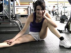 Press play on this hot scene and take a look at this naughty teen brunette sexy body ans especially her round ass while she exercises in the gym.