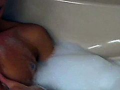 Two guys take advantage of being alone in a bathroom to enjoy their and each others cocks.