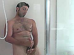 Handsome straight guy Johnny masturbating his enormous phallus in the shower