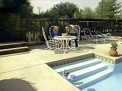 Lovely blonde milfie with big natural tits and huge butt takes sunbath totally naked. One cocky stud eats her meaty shaved pussy and fucks her missionary style over the poolside.