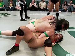 Girls in red and green bikinis fight in a ring. Green team loses a fight, so they lick pussies and also get fingered by girls from the red team.