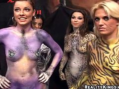 Check this amazing babes, with big boobs and their bodies painted like wild cats, get nailed hard doing a threesome in a funny clip.