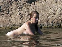 This girl is thick and curvy and has beautiful big breasts! They are so nice and white, and she strips down in the water and rubs one out!