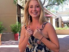 Charming blonde Casy is having some fun in the street. She takes her dress off and rubs her nice natural boobs and then moves her legs wide apart and fingers her pussy.