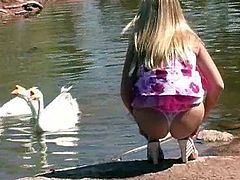 Get wild watching this blonde babe, with big knockers wearing high heels, while she touches herself while and plays with cute animals.