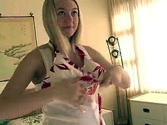 Have fun watching this long haired blonde, with big gazongas wearing a cute bra, while she changes her clothes in front of the camera.