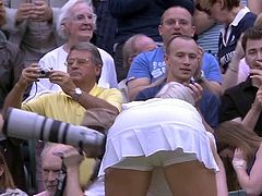 Sweaty tennis babe bending over after match