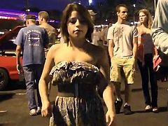 Kinky brown-haired chick Stacey is having fun in the street. She pulls her dress up and demonstrates her ass and then kneads her big natural tits.