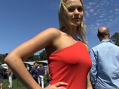The very sexy Jessica showed off her long, amazing legs as she walked around a car show in high heels and a very hot, red dress.