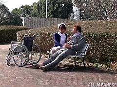 This nurse is a caretaker and the old age home and she sees that one of her patients needs to get some fresh air. She wheels him outside to the park on his wheelchair and then sits him down on the park bench. She sees he has an erection and then rides his old cock.
