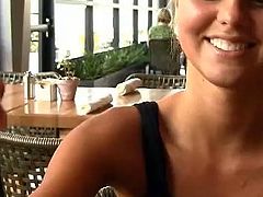 Take a nice look at this blonde babe having a drink at a restaurant and talking about naughty in a reality video. She's smoking hot!