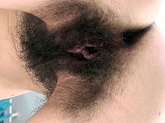 A horny fuckin' slutty bitch with super-hairy pussy sucks on a hard cock and gets it shoved balls deep into her fuckin' gash.