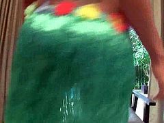 Checkout this sexy brunette Asian Ladyboy Cindy, dressed in her Hawaiian green skirt.See how this sexy babe dancing around and then gets naked for fingering her tight butt hole and jerking her fat cock.