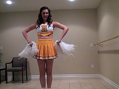 Holly does a dance and shows off her moves to her boyfriend. Her seductive ways really turn him on and before long his dick is bulging out of his jeans. She will take care of that. Look as this cheerleader chick undoes his belt and licks his cock and balls.