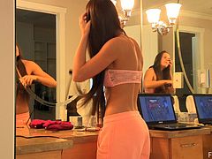 We get a fantastic view of this sexy girl's body including her flawless ass as she strips down and puts on her makeup in her bathroom.