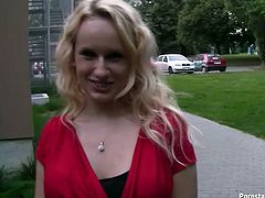 Shiny curly haired blondie in sexy red dress walks around the streets showing off her long legs. She meets some stranger and gets ready to suck his dick...