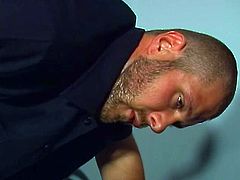 A horny policeman comes in to a convict's cell where he gets sucked and fucks doggy style in this all-male sex video.