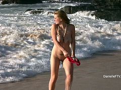 Gorgeous Danielle headed to the beach in her bikini, but she she ended up stripping completely naked and playing in the surf.
