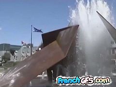French teen plays in a water fountain