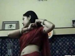 Dark haired young bitch takes her top off and shows her boobs getting her nipples sucked. Have a look at this chick in The Indian Porn sex clip.