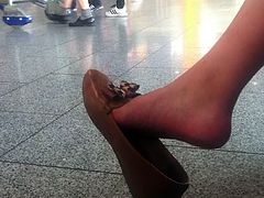 Candid asian girl dangle at the airport