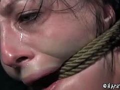 Elise Graves screams as she gets tortured. She is ready for a day full of rope, cocks and canes because that is what she's looking for. Extreme pleasure is promised to her today.