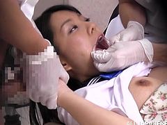 Get a hard dick watching this Asian babe, with a nice ass wearing her school uniform, while she goes hardcore with two horny doctors.