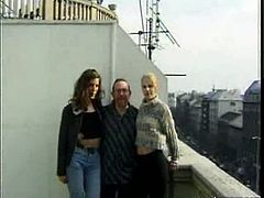 Cathy and another young babe meet Ed Powers. He chats with them on the balcony and then he takes Cathy indoors. Both Cathy and the blonde babe are real cuties.