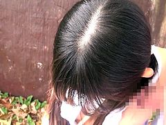This cute Japanese slut is out in the garden and she gets down on her knees to suck his cock. She is very reluctant at first, but he eases her in by rubbing his cock all over her lips and face. Finally she puts his cock in her mouth.