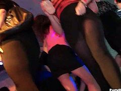 These hot chicks are in a club, dancing provocatively and jerking off cocks. The men are naked and their cocks are stiff for these drunk babes in the mood for fun.