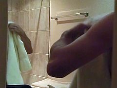 A hot dude is in the bathroom when he gets horny and wanks his big schlong before blowing his load in this free video.