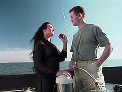 Brunette hottie Asia Carrera is getting naughty with a dude on a boat. She pleases the guy with a blowjob and then sits down on his wang and jumps on it.-