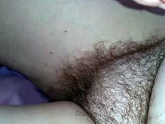 wife rubbing the long pussy pubes of her own hairy pussy