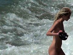 It's a true pleasure for horny voyeur to enjoy such beauty exposing her nude forms while at the beach