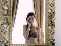 Beautiful Cosmo poses for a camera in a lingerie and stockings. This beauty lies on a bed touching her tits and an ass. This video is worth to see.