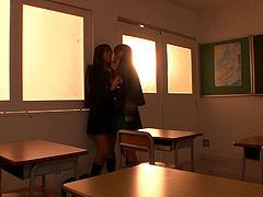 These teenage schoolgirl are supposed to be staying after class to study, but things get far sexier in this Tokyo classroom. The girls kiss and rubs each other while taking off each other's uniforms. Watch them get intimate.