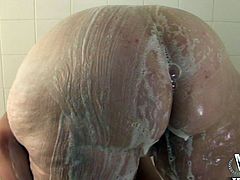 She washes her giant fat ass and gets it all soapy. She gets out of the shower and her man puts oil all over her fat rolls instead. The bbw needs a cock in her mouth now so she goes over to see her boyfriend and sucks his big black cock.