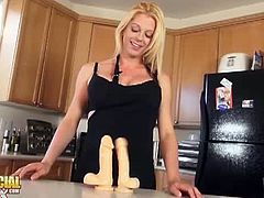 Tyra playing and comparing dildos