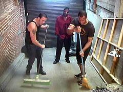 Two guys sweep the floor in some garage. After that they give a double blowjob to a Black dude and get fucked in their asses.