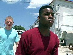 A salacious interracial gay couple are having fun in the street. They have oral sex, then the black dude stands on all fours and lets his buddy pound his asshole from behind.